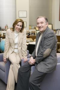 Two professionals sitting on a couch.